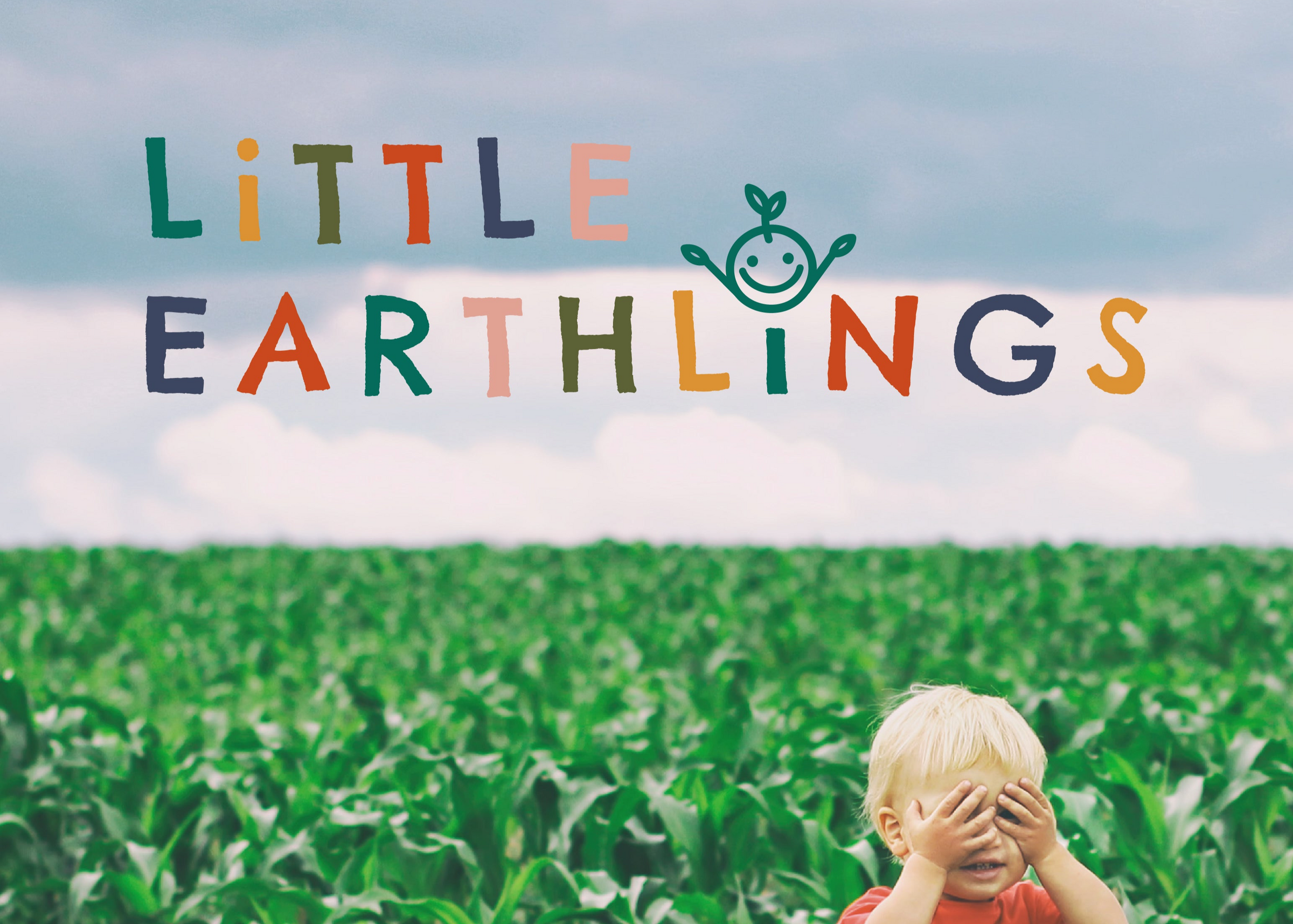 Child in a cornfield with 'Little Earthlings' logo above